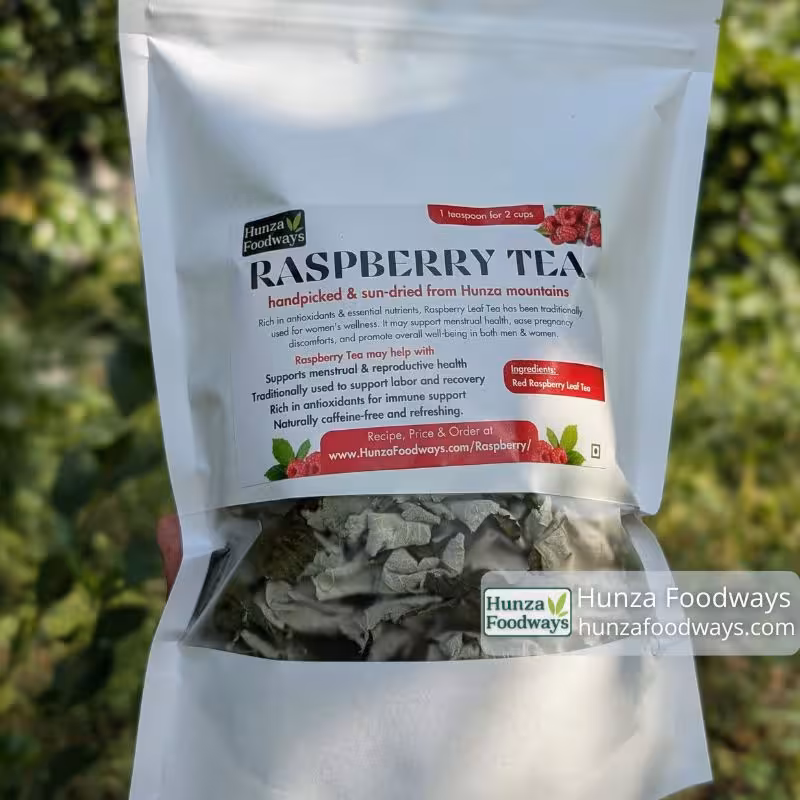 Hunza Foodways red raspberry leaf tea pouch with sun-dried leaves visible through the window, from Hunza, Pakistan